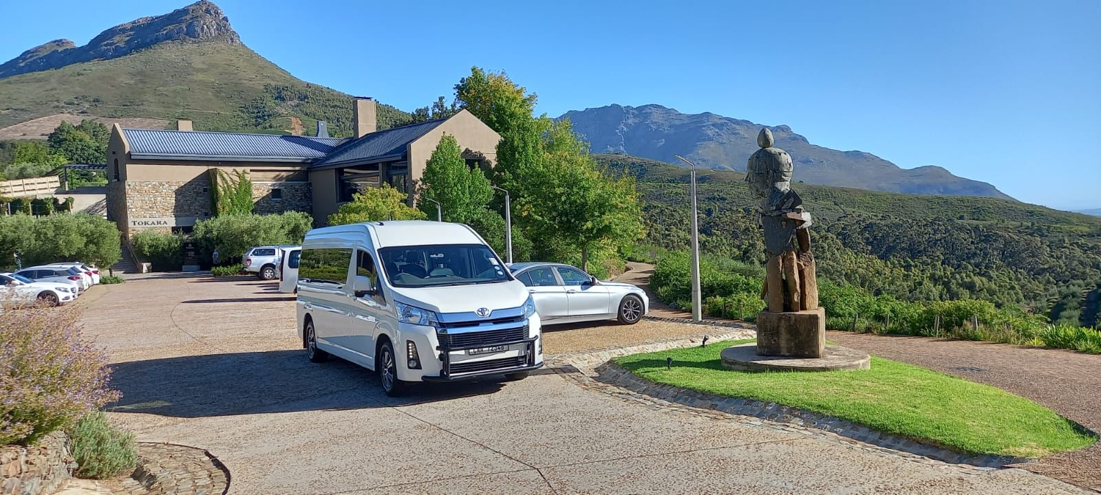 Stellenbosch Shuttles Quantum parked at Tokara wine estate with the Simonsberg behind